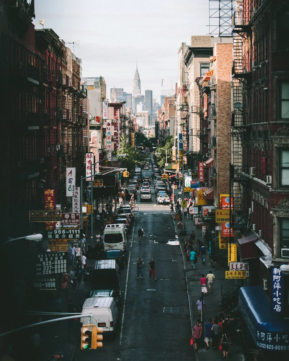 Busy Manhattan street with skyscrapers in the distance