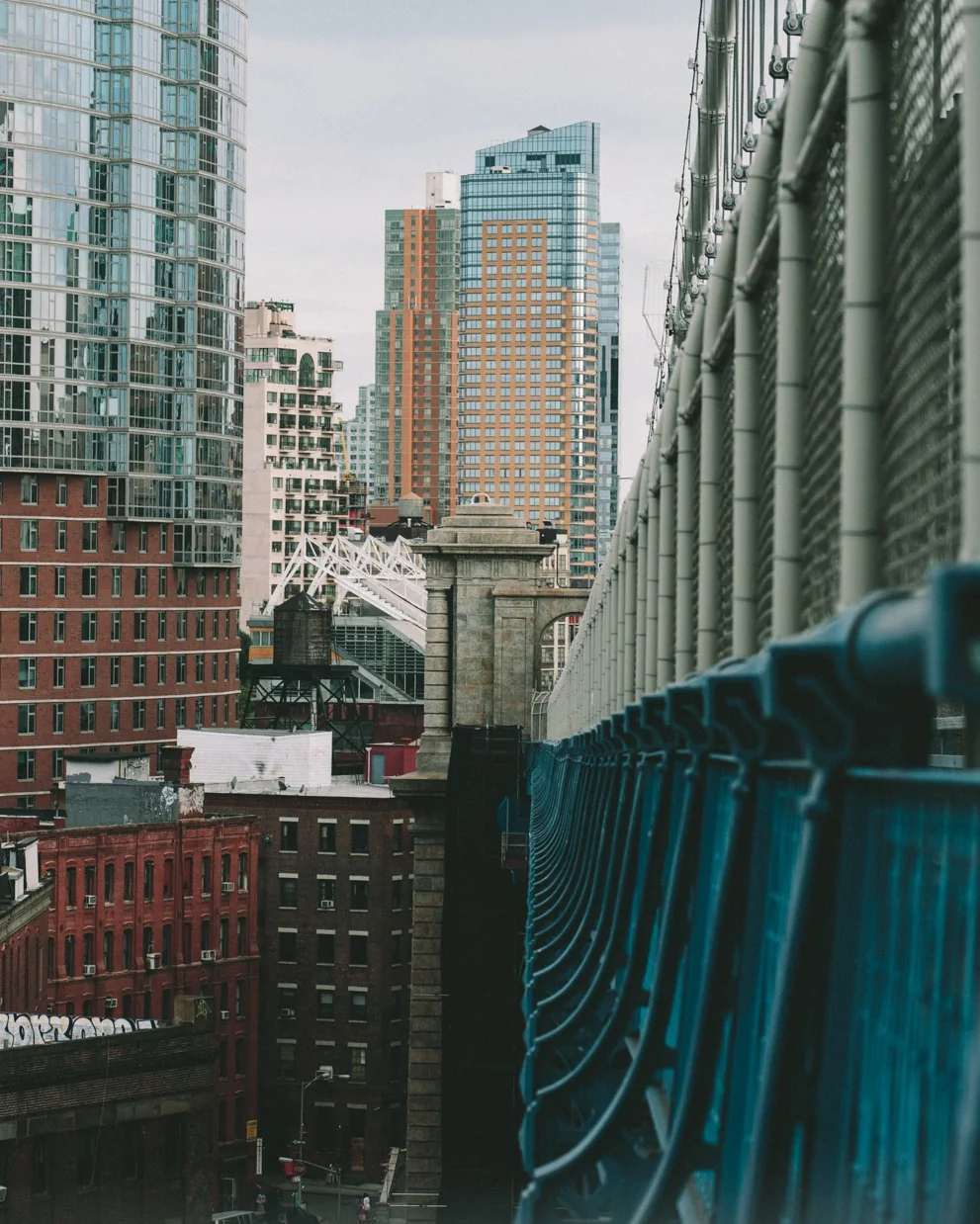 Glass towers seen from an elevated New York walkway